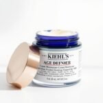 Kiehl's Age Defender Cream Moisturizer jar with product texture visible
